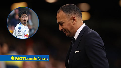 Pascal Struijk playing for Leeds United while standing next to Paraag Marathe, who is smiling at Elland Road.
