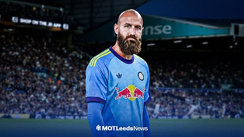 Vanja Milinkovic-Savic wearing a Leeds United shirt in front of Elland Road