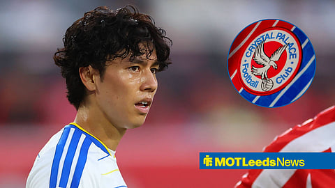 Ao Tanaka playing for Leeds United looking towards the Crystal Palace badge