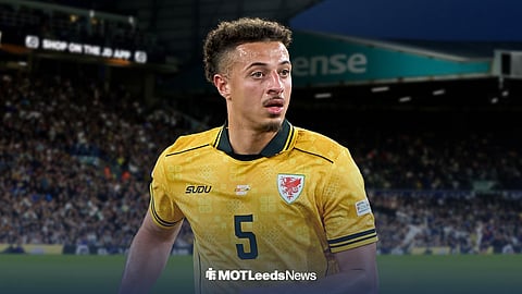 Ethan Ampadu in a yellow Wales away shirt with Elland Road in the background.