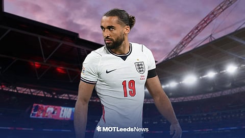 Dominic Calvert-Lewin in new England home kit looking left ahead of Wembley Stadium