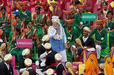 FILE PHOTO: Indian Prime Minister Narendra Modi meets with folk artists after addressing the nation during Independence Day celebrations at the historic Red Fort in Delhi, India, August 15, 2022. 

