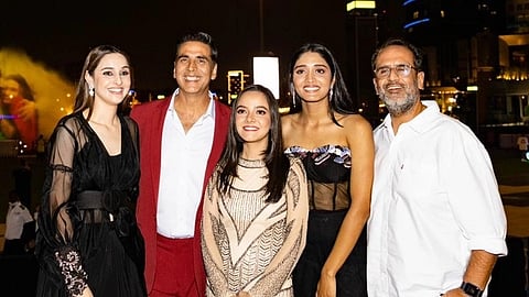 From left to right, Sadia Khateeb, Akshay Kumar, Sahejmeen Kaur, Smrithi Srikanth, and Director Anand L. Rai posing in front of the Intercontinental Hotel, Dubai festival city. 