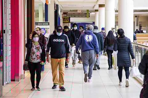 FILE PHOTO - Shoppers walk in Bramalea City Centre mall in Brampton two days before COVID-19 restrictions are reintroduced to Greater Toronto Area regions in Ontario, Canada November 21, 2020. 