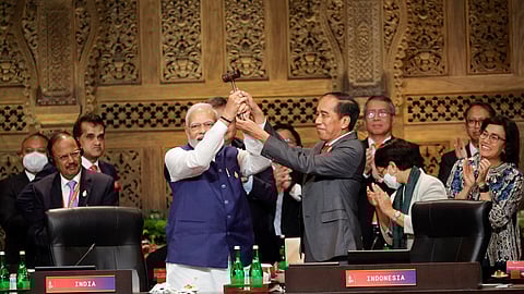 India's Prime Minister Narendra Modi and Indonesia's President Joko Widodo take part in the handover ceremony at the G20 Leaders' Summit, in Nusa Dua, Bali, Indonesia, November 16, 2022. 