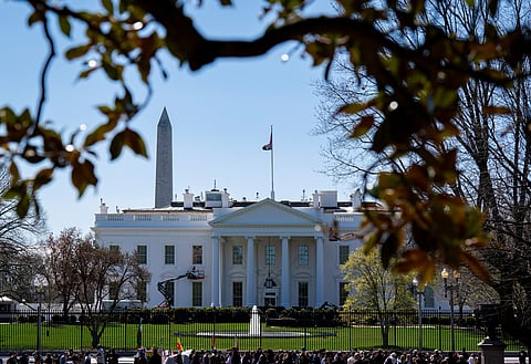 Tourists visit Lafayette Square near the White House in Washington, U.S., March 26, 2023. 