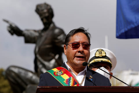 FILE PHOTO: Bolivian President Luis Arce, in front of a statue of national hero Eduardo Abaroa, speaks at a ceremony marking the landlocked country's claim to maritime access, lost to Chile after the War of the Pacific, in La Paz, Bolivia March 23, 2022. 