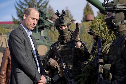 The Prince of Wales (left) meeting members of the Polish military during a visit to the 3rd Brigade Territorial Defence Force base, in Rzeszow, Poland, that has been heavily involved in providing support to Ukraine. March 22, 2023. 