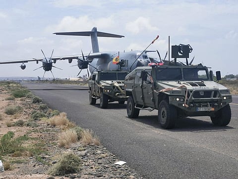 Spanish military plane and military vehicles are seen departing on tarmac as Spanish diplomatic personnel and citizens are evacuated, in Khartoum, Sudan, April 23, 2023. 
