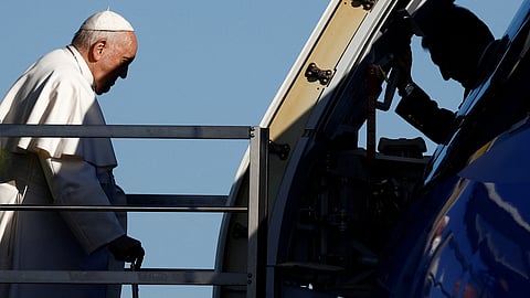 Pope Francis boards the papal plane ahead of his apostolic visit to Hungary at Fiumicino airport in Rome, Italy, April 28, 2023. 