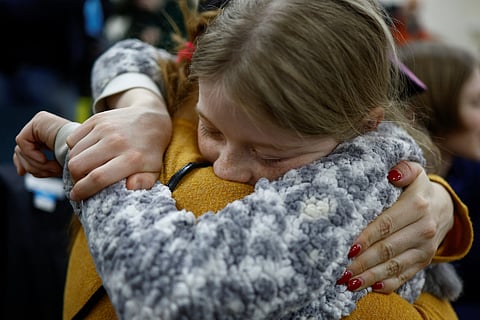 Valeriia, who went to a Russian-organised summer camp from non-government controlled territories and was then taken to Russia, embraces her mother Anastasiia after returning via the Ukraine-Belarus border, in Kyiv, Ukraine April 8, 2023. 