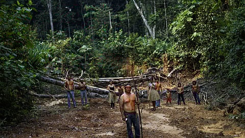 FILE PHOTO: Indigenous Mura people pose for a picture in a deforested area of a non-demarcated indigenous land in the Amazon rainforest near Humaita, Amazonas State, Brazil, August 20, 2019. 
