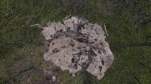 A general view of the site where the remains of an unidentified military object were found in a forest near the city of Bydgoszcz, Poland, April 27, 2023. 