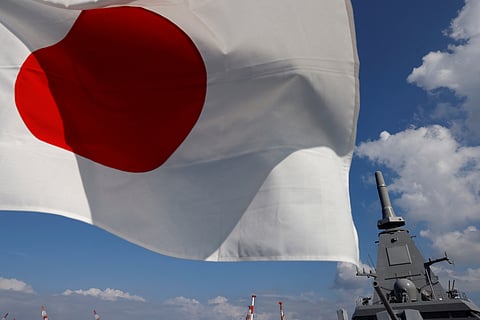 FILE PHOTO: Japan's naval ship 'Mogami', featuring stealth capability, is seen next to a Japan's national flag at the Japan Maritime Self-Defense Force (JMSDF) naval base in Yokosuka, Kanagawa Prefecture, Japan September 5, 2022. 
