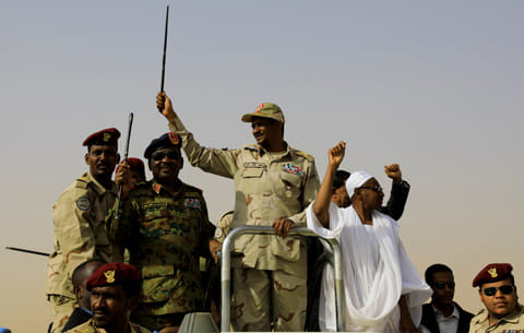 FILE PHOTO: Mohamed Hamdan Dagalo, head of the Rapid Support Forces, greets his supporters as he arrives at a meeting in Aprag, Sudan, June 22, 2019. 