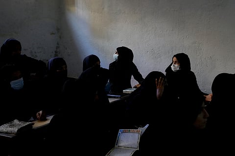FILE PHOTO: Afghan women learn how to read the Koran in a madrasa or religious school in Kabul, Afghanistan, October 8, 2022. 