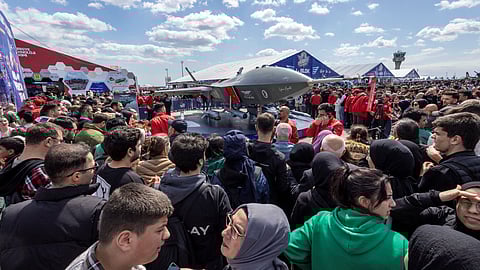 Visitors surround Kizilelma, company's newest 15 meter jet powered ground attack drone, at Teknofest airshow in Istanbul, Turkey, April 28, 2023. 