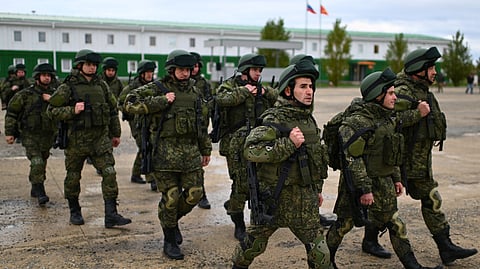 FILE PHOTO: Russian reservists recruited during the partial mobilisation of troops attend a ceremony before departing to the zone of Russia-Ukraine conflict, in the Rostov region, Russia October 31, 2022. 