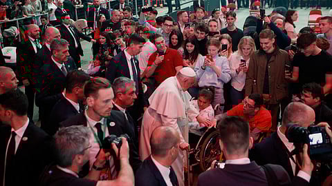 Remo Casilli greets people as he arrives to attend a meeting with youth at the Laszlo Papp Sport Arena during his apostolic journey in Budapest, Hungary, April 29, 2023. 