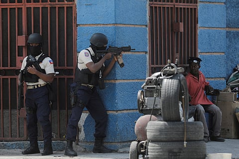 FILE PHOTO: Police officers take position as they take part in an anti-gang operation amid gang violence in Port-au-Prince, Haiti March 3, 2023. 