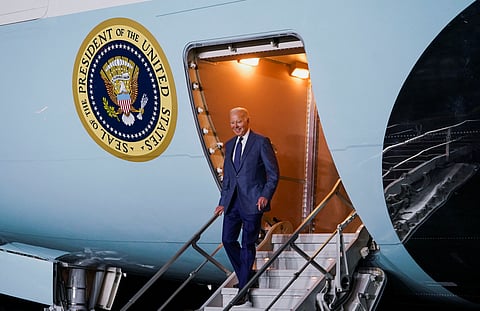 U.S. President Joe Biden disembarks Air Force One upon his arrival at RAF Aldergrove airbase in County Antrim, Northern Ireland April 11, 2023. 