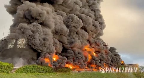 A still image from a video shows smoke rising following an alleged drone attack on oil depot in Sevastopol, Crimea, April 29, 2023. 