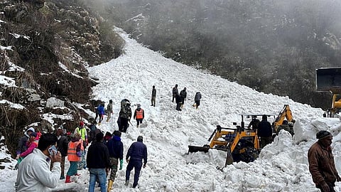 Rescue team members search for survivors after an avalanche in the northeastern state of Sikkim, India, April 4, 2023. 