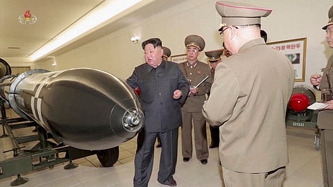 FILE PHOTO: A screen grab shows North Korean leader Kim Jong Un inspecting nuclear warheads at an undisclosed location in this undated still image used in a video. 