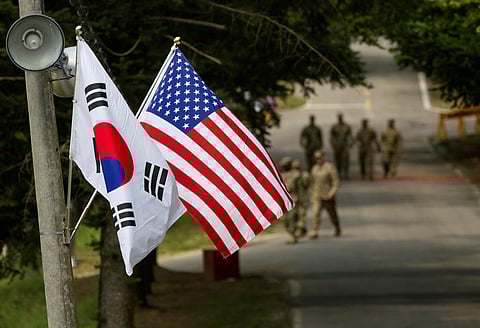 FILE PHOTO: The South Korean and American flags fly next to each other at Yongin, South Korea, August 23, 2016. Picture taken on August 23, 2016. 
