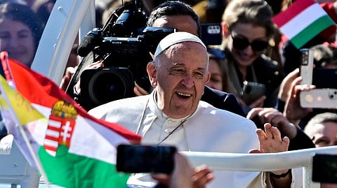 Pope Francis greets the crowd ahead of a holy mass at the Kossuth Lajos Square during his apostolic journey in Budapest, Hungary, April 30, 2023. 