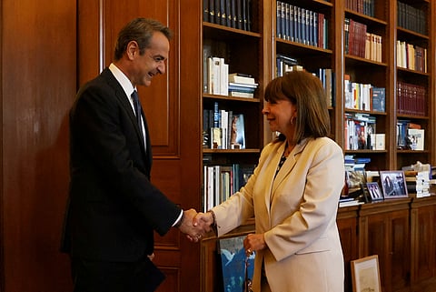 Greek Prime Minister Kyriakos Mitsotakis meets with Greek President Katerina Sakellaropoulou to discuss snap elections at the Presidential Palace in Athens, Greece April 22, 2023. 