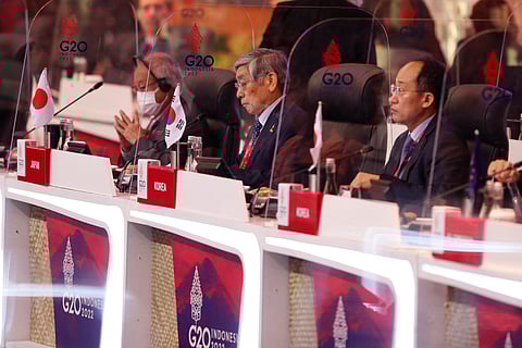 FILE PHOTO: Japanese Finance Minister Shunichi Suzuki, Japan's Central Bank Governor Haruhiko Kuroda, South Korea Finance Minister Choo Kyung-ho attend the G20 Finance Ministers and Central Bank Governors Meeting in Nusa Dua, Bali, Indonesia, 15 July 2022. 