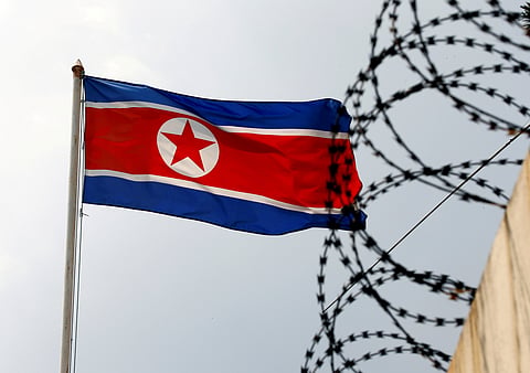 FILE PHOTO: A North Korea flag flutters next to concertina wire at the North Korean embassy in Kuala Lumpur, Malaysia March 9, 2017. 