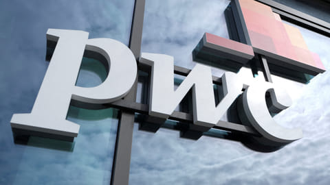 FILE PHOTO: The logo of Price Waterhouse Coopers is seen at its Berlin office in Berlin, Germany, September 20, 2019. 