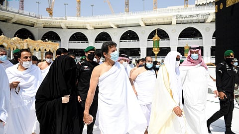 FILE PHOTO: Pakistani Prime Minister Imran Khan performs umrah on the 27th day of Ramadan with his wife, Bushra Bibi, in the Grand Mosque, in the holy city of Mecca, Saudi Arabia, May 9, 2021. 