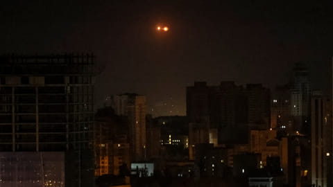 An explosion of a drone is seen in the sky over the city during a Russian drone strike, amid Russia's attack on Ukraine, in Kyiv, Ukraine May 25, 2023. 