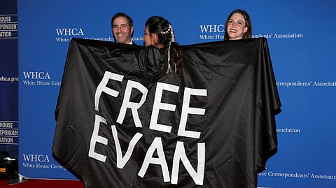FILE PHOTO: Washington Post reporter Vivian Salama wears a cape reading "Free Evan", referring to detained Wall Street Journal reporter Evan Gershkovich who was arrested on March 30 in Russia and subsequently charged with espionage, a charge he has denied, on the red carpet arriving for the annual White House Correspondents' Association (WHCA) Dinner in Washington, U.S., April 29, 2023. 