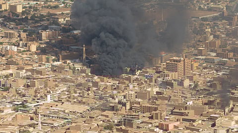 A screen grab shows black smoke and fire at Omdurman market in Omdurman, Sudan, May 15, 2023. 