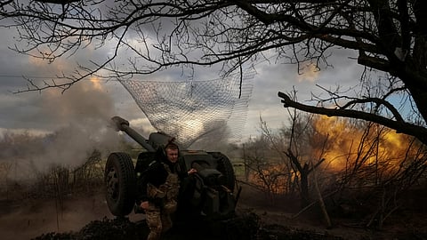 FILE PHOTO: Ukrainian service members from a 3rd separate assault brigade of the Armed Forces of Ukraine, fire a howitzer D30 at a front line, amid Russia's attack on Ukraine, near the city of Bakhmut, Ukraine April 23, 2023. 