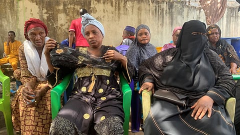 Mariame Diallo, the mother of Boubacar Diallo, 17, who was killed during the May clashes between demonstrators and security forces, gestures while she is surrounded by relatives and friends who came to support her in Conakry, Guinea May 11, 2023. 