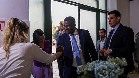 Conservative New Democracy party candidate Spiros Richard Hagabimana arrives for an election campaign event at the neighbourhood of Nikaia, near Athens, Greece, May 12, 2023. 