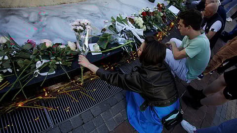 People light up candles to pay tribute for victims of Belgrade school mass shooting in Podgorica, Montenegro, May 5, 2023. 