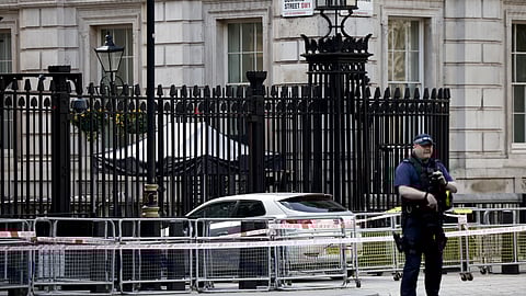 FILE PHOTO: A police officer works at the site where a car crashed into the front gates of Downing Street in London, Britain, May 25, 2023. 