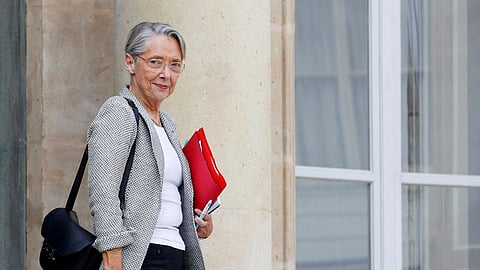 FILE PHOTO: French Prime Minister Elisabeth Borne leaves following a meeting with French President Emmanuel Macron, the leaders of the French Employers' association (MEDEF), the CPME and the Union of local businesses, after he signed into law the pension reform raising the retirement age, at the Elysee Palace in Paris, France, April 18, 2023. 