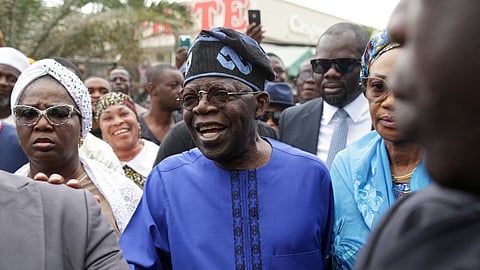 FILE PHOTO: Presidential candidate Bola Ahmed Tinubu arrives at a polling station before casting his ballot in Ikeja, Lagos, Nigeria February 25, 2023 
