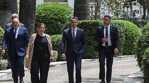 Greek Prime Minister Kyriakos Mitsotakis walks at the Presidential Palace, at a meeting with Greek President Katerina Sakellaropoulou, to receive an official mandate to try to form a coalition government after the general election, in Athens, Greece, May 22, 2023. 