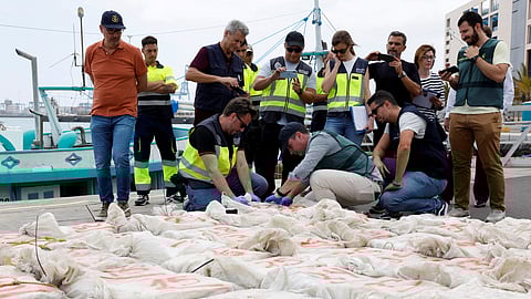 Spanish police officers carry out a test on drugs found on an intercepted Brazilian fishing vessel carrying approximately 1500 kg of cocaine in Gran Canaria, Spain, May 12, 2023. 
