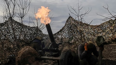 FILE PHOTO: Ukrainian service members fire a mortar towards Russian troops outside the frontline town of Bakhmut, amid Russia's attack on Ukraine, in Donetsk region, Ukraine March 6, 2023. 