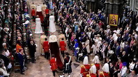 Britain's King Charles III, center, and Camilla, the Queen Consort, top center, arrive during the coronation ceremony of Britain's King Charles III at Westminster Abbey in London Saturday, May 6, 2023. 