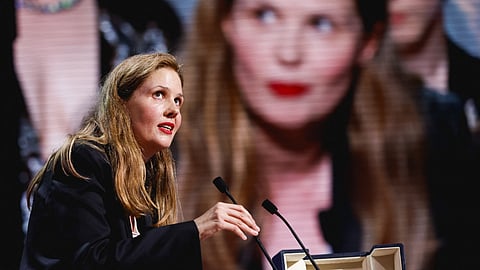 Director Justine Triet, Palme d'Or award winner for the film "Anatomie d'une chute" (Anatomy of a Fall), delivers a speech during the closing ceremony of the 76th Cannes Film Festival in Cannes, France, May 27, 2023. 